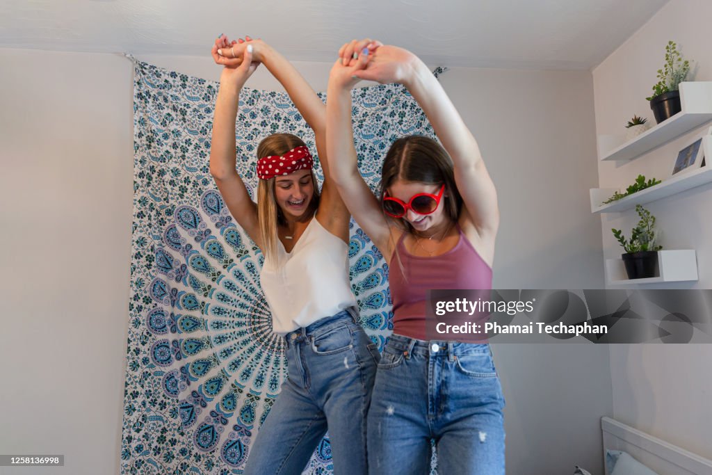 Two sisters dancing