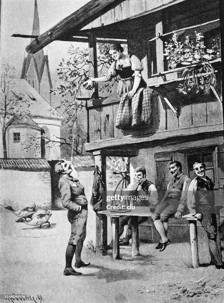 Penny farthing bicyclists having a rest in Garmisch-Partenkirchen