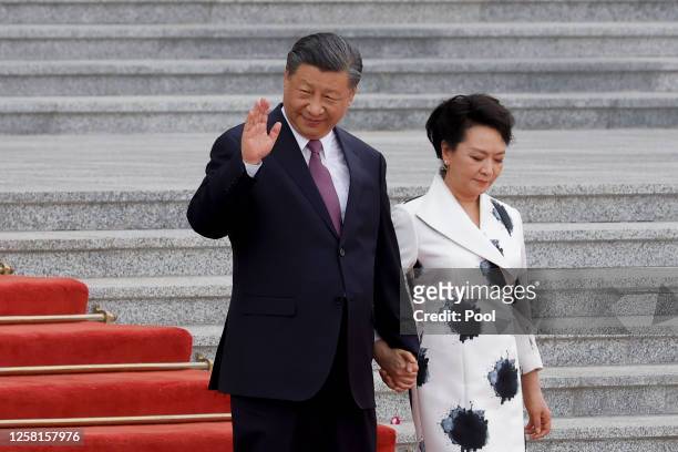 President Xi Jinping and his wife Peng Liyuan attend a welcoming ceremony for Democratic Republic of Congo's President Felix Tshisekedi at the Great...