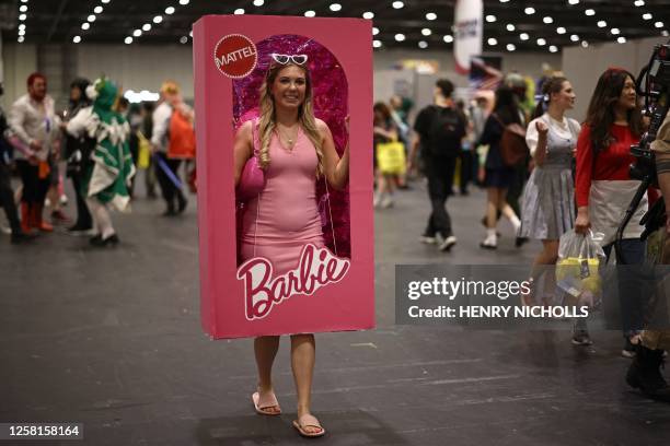 Cosplayer dressed as a boxed Barbie doll attends the MCM Comic Con at ExCeL exhibition centre in London on May 26, 2023.