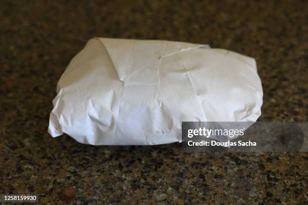 butchers paper with fresh meat product wrapped for purchase - butcher paper foto e immagini stock