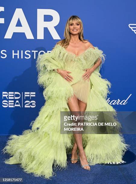 German model Heidi Klum arrives to attend the annual amfAR Cinema Against AIDS Cannes Gala at the Hotel du Cap-Eden-Roc in Cap d'Antibes, southern...