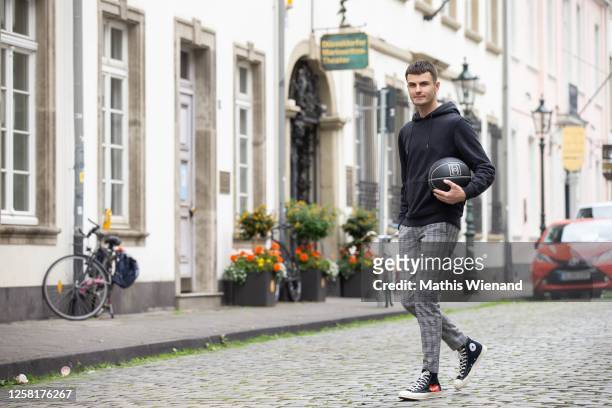Paul Henry Duval wearing by Comme des Garcons x Converse shoes, boohoo men pants, Arket hooded sweatshirt, Chanel 2004 limited edition Basketball,...