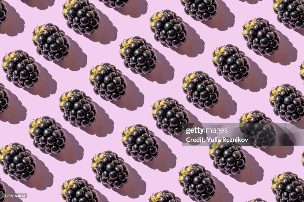 Repeated blackberries on the purple background