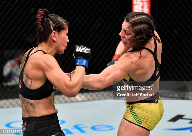 Bethe Correia of Brazil punches Pannie Kianzad of Iran in their bantamweight fight during the UFC Fight Night event inside Flash Forum on UFC Fight...