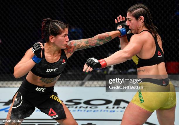 Pannie Kianzad of Iran punches Bethe Correia of Brazil in their bantamweight fight during the UFC Fight Night event inside Flash Forum on UFC Fight...