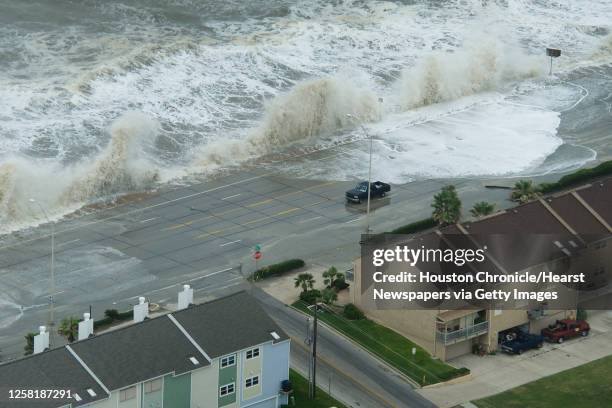 Waves crash over the seawall on Galveston Island as Hurricane Ike approaches the Texas Gulf Coast, Friday, Sept. 12, 2008.