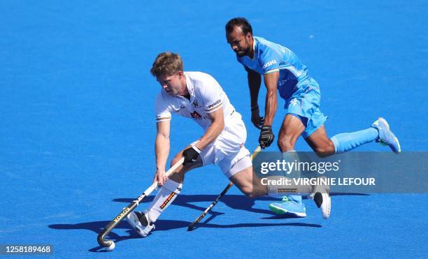 Belgium's Victor Wegnez fights for the ball during a game between Belgium's Red Lions and India, the first match in the group stage of the 2023 Men's...