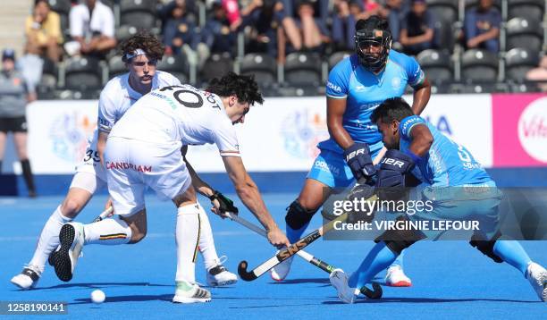Belgium's Roman Duvekot fights for the ball during a game between Belgium's Red Lions and India, the first match in the group stage of the 2023 Men's...
