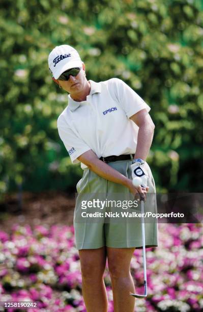 Karrie Webb of Australia pitches onto the 18th green during the first round of the Evian Masters at the Evian Resort Golf Club on June 12, 2002 in...