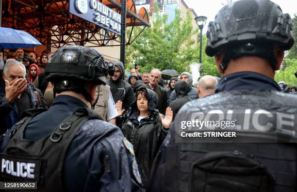 Kosovo riot police secure a municipal building after dispersing protestors demonstrating after police helped install ethnic Albanian mayors following...