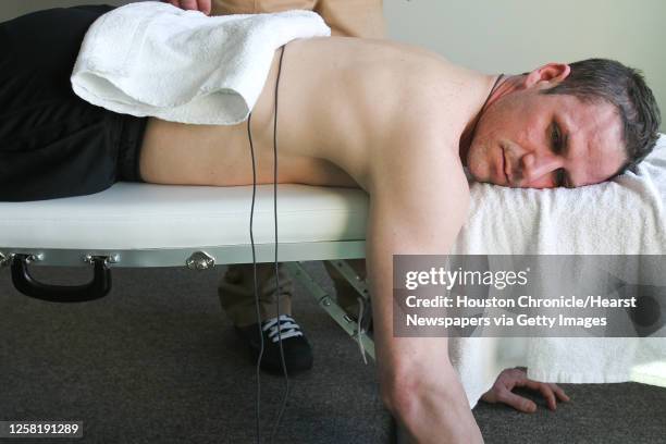 Speedskater Chad Hedrick of Spring, Texas, undergoes chiropractic treatment in the team residence at the athletes village in advance of the 2010...