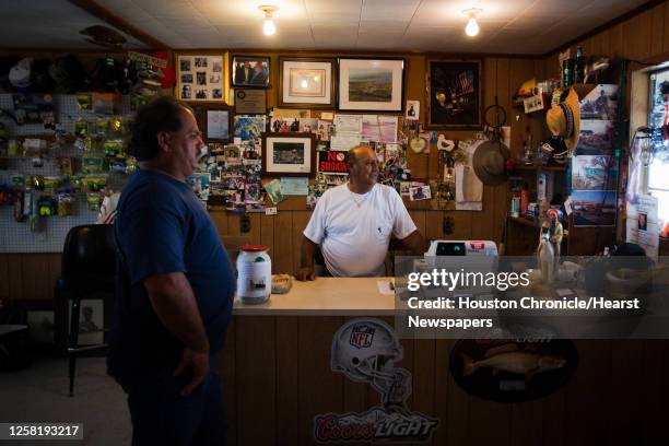 Dale and Theo Chaisson look out over the boat ramps that sit empty at Isle de Jean Charles Marina, Thursday, June 24 in Pointe Aux Chenes, La. The...