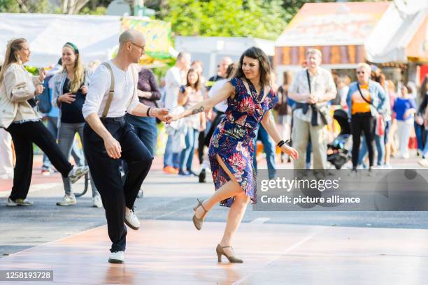 Leanna and Gasper swing dance at the street party on the first day of the Carnival of Cultures. Around half a million people are expected to attend...