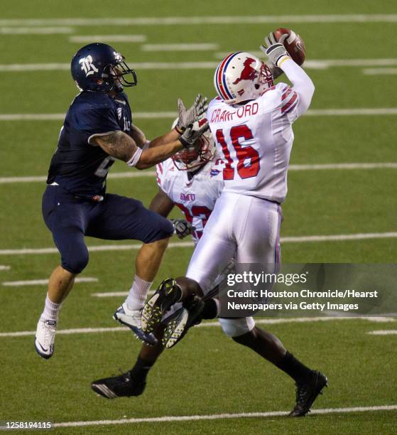 Southern Methodist Mustangs cornerback Richard Crawford intercepts a pass intended for Rice Owls running back Sam McGuffie during the second half in...