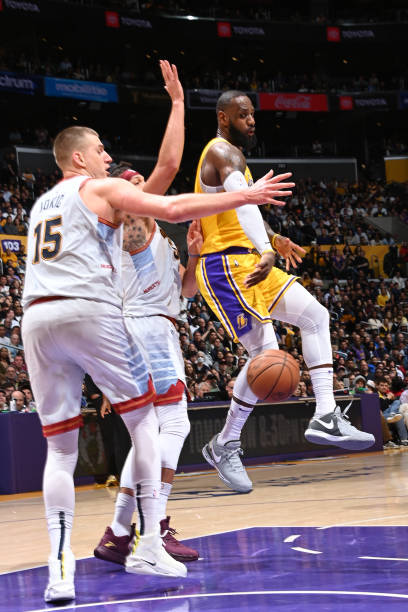 LeBron James of the Los Angeles Lakers passes the ball during the game against the Denver Nuggets during Round 3 Game 4 of the Western Conference...