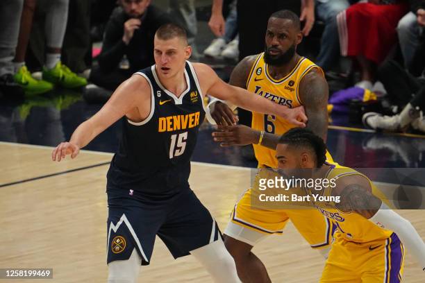 LeBron James of the Los Angeles Lakers plays defense against Nikola Jokic of the Denver Nuggets during Game 2 of the 2023 NBA Playoffs Western...