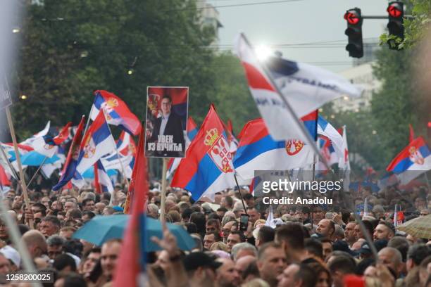 People march during a demonstration in support of Serbian President Aleksandar Vucic following protests against him after two mass shootings in...