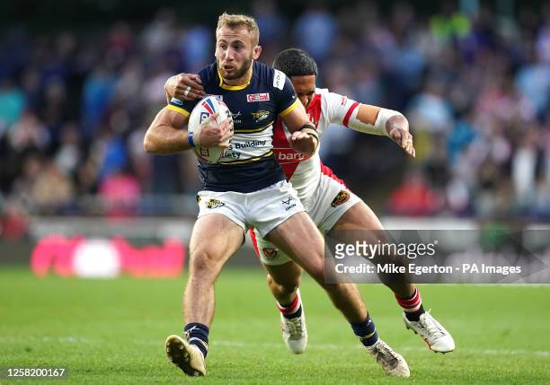 Leeds Rhinos' Jarrod O'Connor is tackled by St Helens' Sione Mata'utia during the Betfred Super League match at Headingley Stadium, Leeds. Picture...