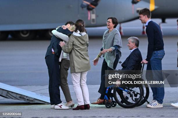 Olivier Vandecasteele pictured finally meeting his family during the arrival of Belgian humanitarian worker Olivier Vandecasteele who was released...