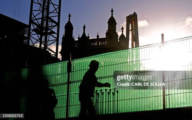 Construction worker operates machinery on a building site in central London, on November 12, 2008. Britain's unemployment rate jumped to an 11-year...
