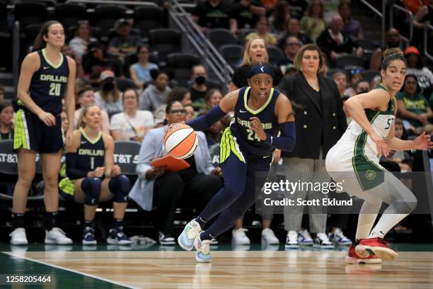 Arike Ogunbowale of the Dallas Wings dribbles the ball during the game against the Seattle Storm on May 26, 2023 at Climate Pledge Arena in Seattle,...