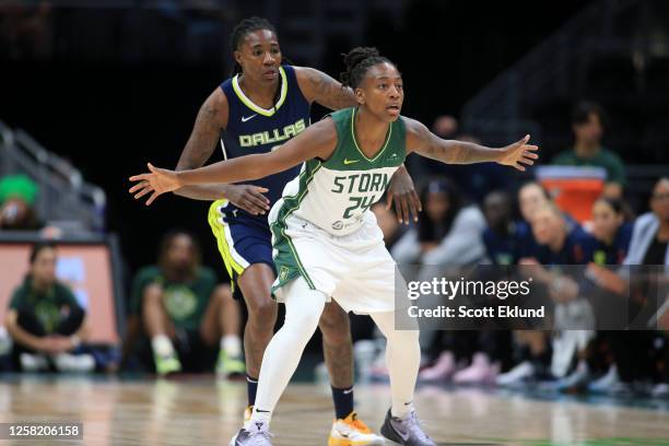 Natasha Howard of the Dallas Wings and Jewell Loyd of the Seattle Storm look on during the game on May 26, 2023 at Climate Pledge Arena in Seattle,...