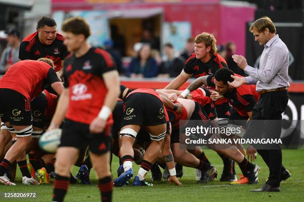 Crusaders' coach Scott Robertson applauds his players prior to the start of the round 14 Super Rugby Pacific match between the Crusaders and the New...