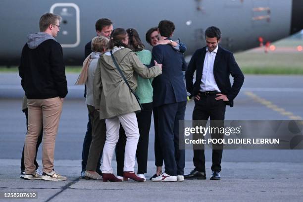 Olivier Vandecasteele pictured finally meeting his family during the arrival of Belgian humanitarian worker Olivier Vandecasteele who was released...