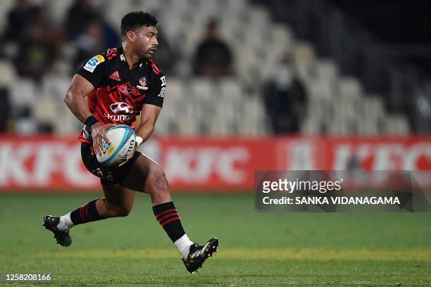 Crusaders' Richie Mo'unga runs with the ball during the round 14 Super Rugby Pacific match between the Crusaders and Waratahs at Orangetheory Stadium...