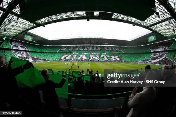 Celtic fans display a tifo whcih reads 'Stand on the shoulders of giants' during a cinch Premiership match between Celtic and Aberdeen at Celtic...