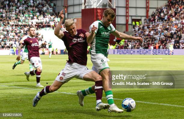 Alex Cochrane and Chris Cadden in action during a cinch Premiership match between Heart of Midlothian and Hibernian at Tynecastle Park, on May 27 in...