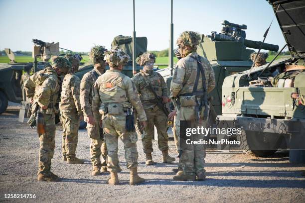 Members of the US Army 101st Airborne Division, 1st battallion of the 506th infantry regiment are seen with Hummer vehicles near Tapa, Estonia on 19...