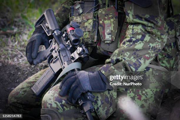 An Estonian soldier holds an M4 carbine automatic rifle during an exercise near Tapa, Estonia on 19 May, 2023. Estonia is hosting the Spring Storm...