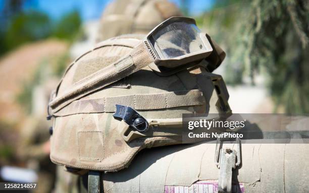 Kevlar helmet is seen with safety glasses during an exercise near Tapa, Estonia on 20 May, 2023. Estonia is hosting the Spring Storm NATO exercises...