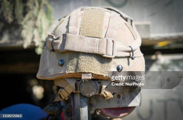 Kevlar helmet is seen on the door of an infantry fighting vehicle near Tapa, Estonia on 20 May, 2023. Estonia is hosting the Spring Storm NATO...