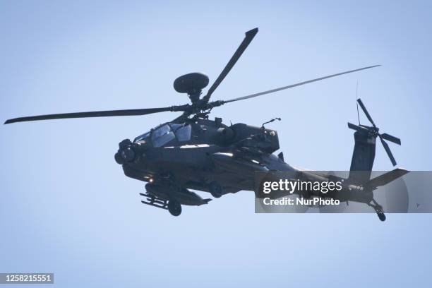 An Apache helicopter is seen flying over an army base in Tapa, Estonia on 20 May, 2023. Estonia is hosting the Spring Storm NATO exercises involving...