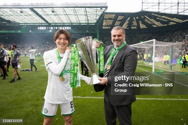 Celtic's Kyogo Furuhashi and Manager Ange Postecoglou celebrate winning the cinch Premiership title during a cinch Premiership match between Celtic...