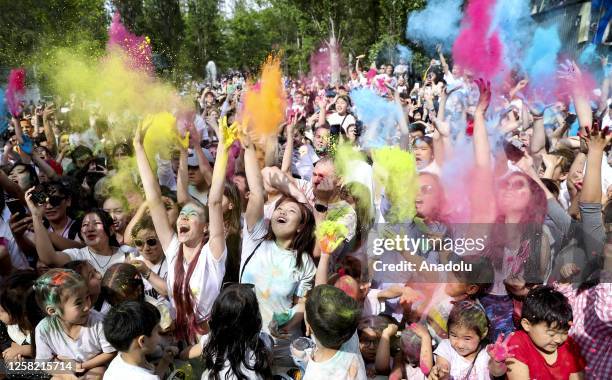 People take part in the Festival of Colors in Asanbai Park in Bishkek, Kyrgyzstan on May 27, 2023. The event belongs to the traditional Holi festival...