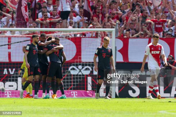 Kingsley Coman of Bayern Muenchen celebrates after scoring his team's first goal with teammates during the Bundesliga match between 1. FC Köln and FC...