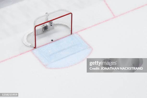 The puck is seen in the net after Canada's fourth goal scored by Scott Laughton during the IIHF Ice Hockey Men's World Championship semi-final match...