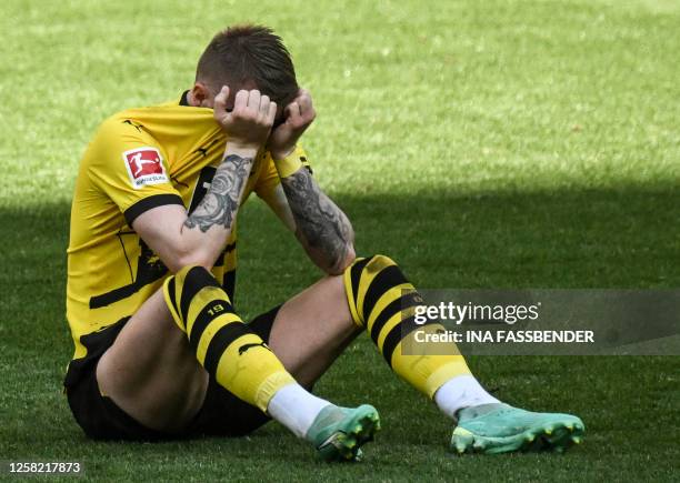 Dortmund's German forward Marco Reus reacts after the German first division Bundesliga football match between Borussia Dortmund and 1 FSV Mainz 05 in...