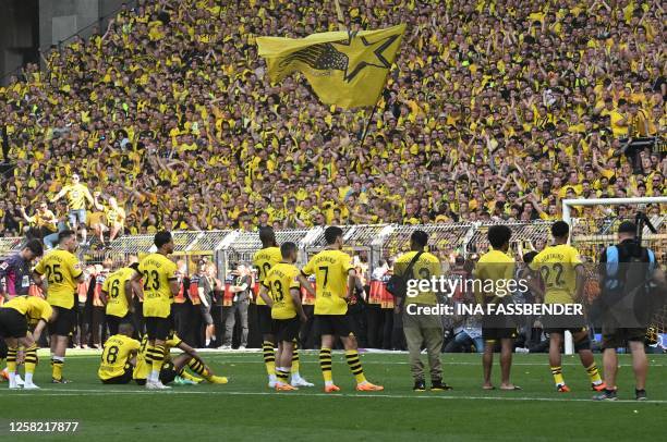 Dortmund players go to their fans after the German first division Bundesliga football match between Borussia Dortmund and 1 FSV Mainz 05 in Dortmund,...