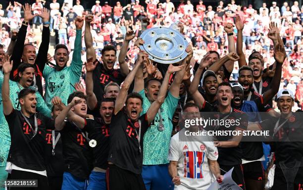 Bayern Munich's players celebrate with the trophy after the German first division Bundesliga football match between FC Cologne and FC Bayern Munich...