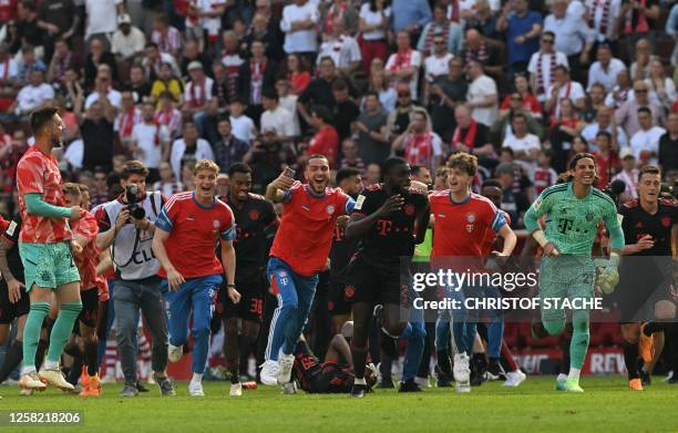 Bayern Munich's players react at the final whistle of the German first division Bundesliga football match between FC Cologne and FC Bayern Munich in...