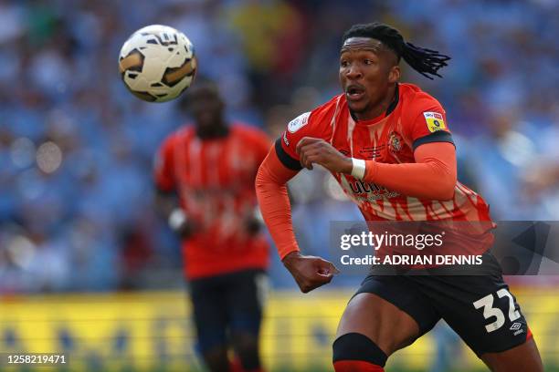 Luton Town's English defender Gabriel Osho chases the ball during the English Championship play-off final football match between Coventry City and...