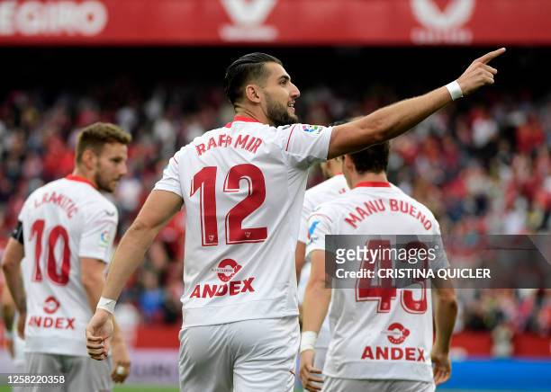 Sevilla's Spanish forward Rafa Mir celebrates after scoring a goal during the Spanish league football match between Sevilla FC and Real Madrid CF at...
