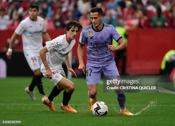 Real Madrid's Spanish forward Lucas Vazquez vies with Sevilla's Spanish forward Bryan Gil during the Spanish league football match between Sevilla FC...