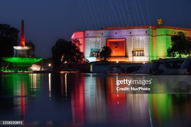 An illuminated view of the new parliament building in the colours of the national tri-colour on the eve of its inauguration in New Delhi, India on...