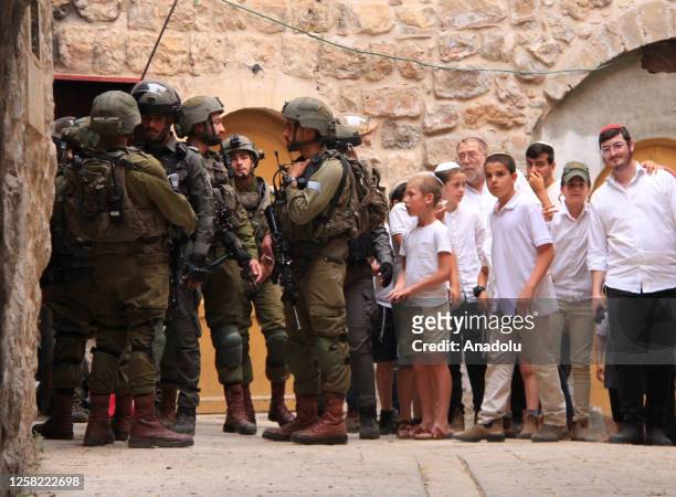 Group of Jewish settlers raid the city of Hebron under the auspices of Israeli forces, in Hebron, West Bank on May 27, 2023. During the raid, Israeli...